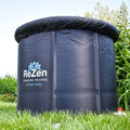 A close up of a covered rezen ice bath in a green garden.